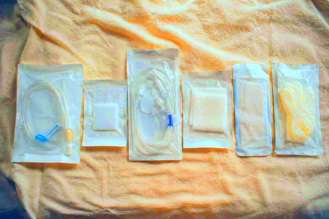 Sealed single use supplies laid out on linen