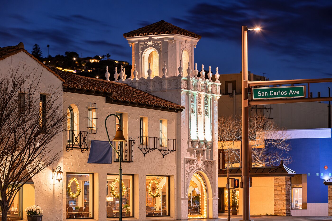 San Carlos Avenue at dusk, with its Spanish revival tower lit up